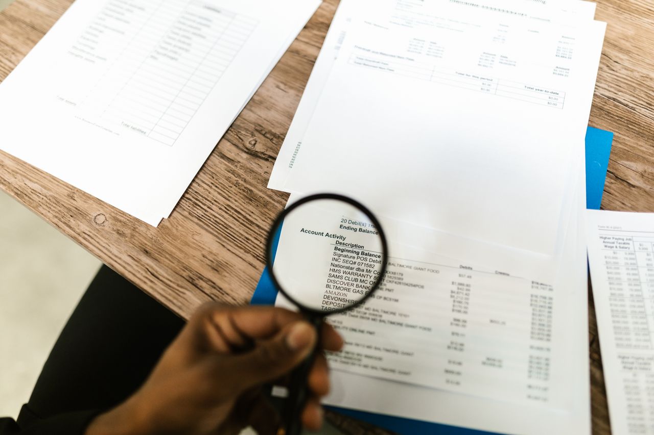 Examining records in detail with a magnifying glass